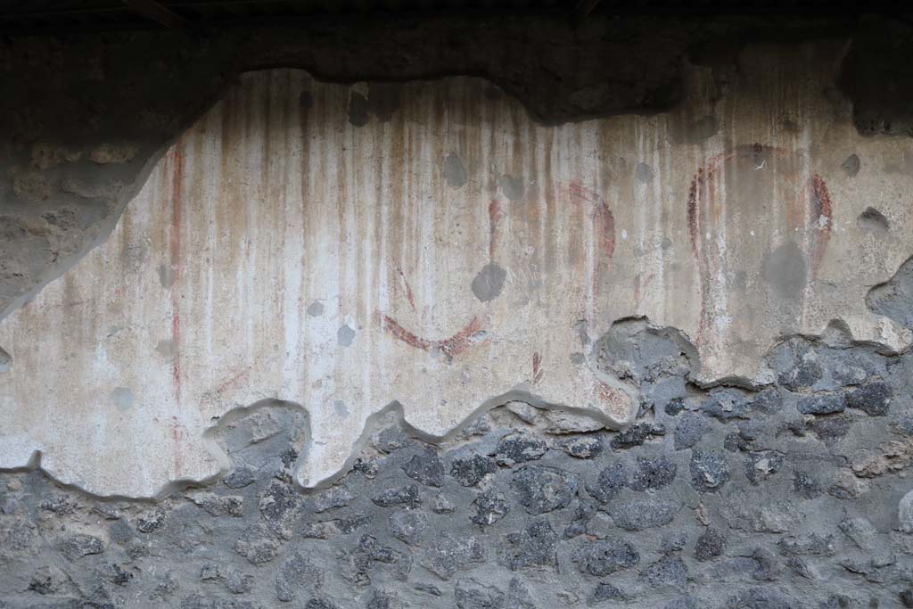 Pompeii Street Altar at I.8.1. December 2018. Detail of remains of painting to north of altar. Photo courtesy of Aude Durand.