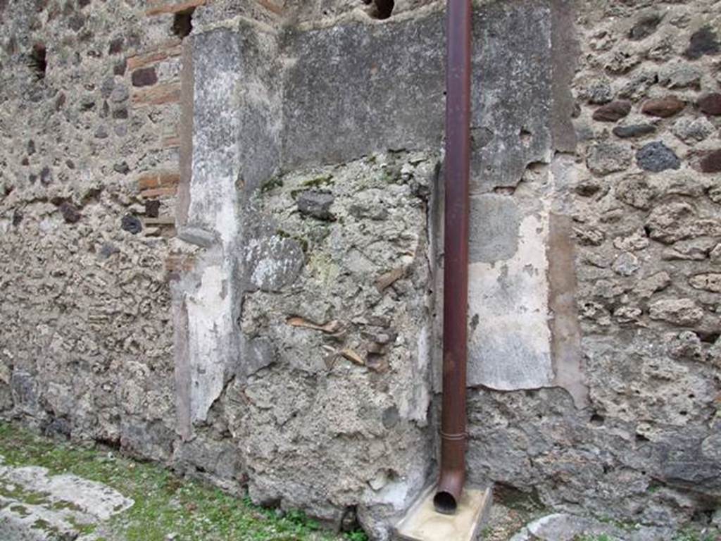 IX.2.19 Pompeii. December 2007. Buttress of masonry and remains of painted walls of street shrine.