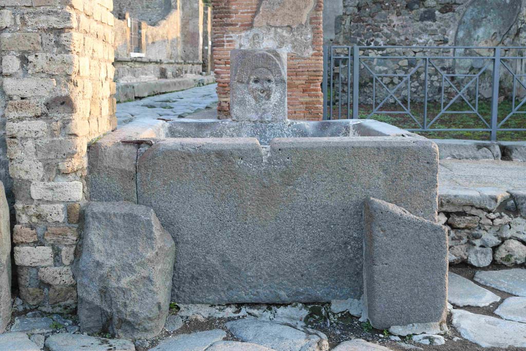 Fountain outside I.4.15 on Via Stabiana. December 2018. 
Looking across Holconius crossroads towards fountain. Photo courtesy of Aude Durand.
