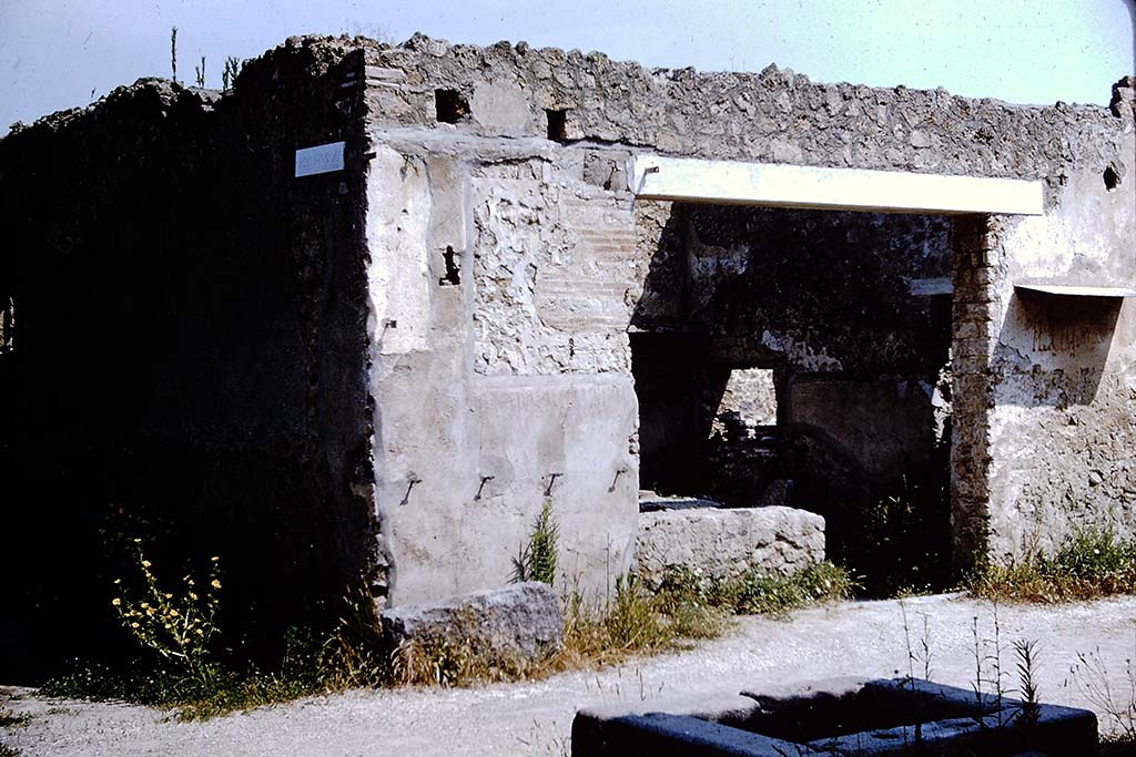 Via di Castricio, north side, Pompeii. 1964. Looking north towards I.11.11, from fountain outside I.16.4. 
Photo by Stanley A. Jashemski.
Source: The Wilhelmina and Stanley A. Jashemski archive in the University of Maryland Library, Special Collections (See collection page) and made available under the Creative Commons Attribution-Non-Commercial License v.4. See Licence and use details.
J64f1490
