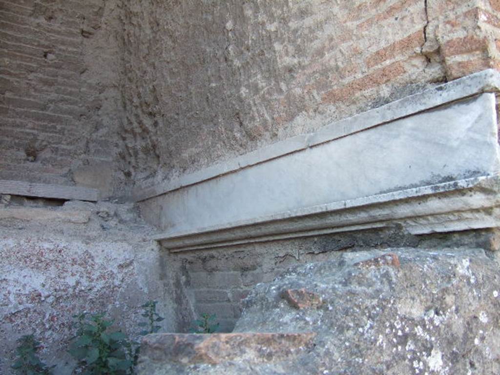 Fountain in arch at north-east corner of Forum. May 2006. Marble cladding on west side of interior.