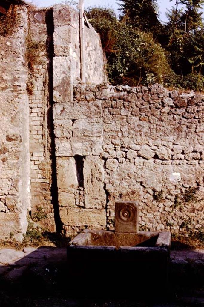 Fountain outside IX.10.2, Pompeii, 1980. Photo by Stanley A. Jashemski.   
Source: The Wilhelmina and Stanley A. Jashemski archive in the University of Maryland Library, Special Collections (See collection page) and made available under the Creative Commons Attribution-Non Commercial License v.4. See Licence and use details. J80f0222
