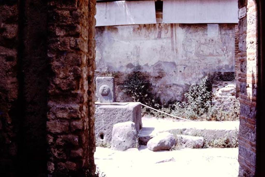 Fountain at IX.11.1 and street altar, Pompeii, 1980. Looking north across Via dell’Abbondanza. Photo by Stanley A. Jashemski.
Source: The Wilhelmina and Stanley A. Jashemski archive in the University of Maryland Library, Special Collections (See collection page) and made available under the Creative Commons Attribution-Non Commercial License v.4. See Licence and use details. J80f0225