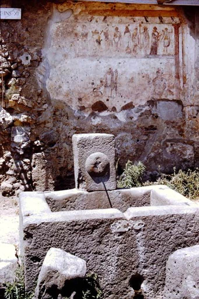 Fountain at IX.11.1 Pompeii. 1966. Looking north from fountain to street shrine on north side of Via dell’Abbondanza. Photo by Stanley A. Jashemski.
Source: The Wilhelmina and Stanley A. Jashemski archive in the University of Maryland Library, Special Collections (See collection page) and made available under the Creative Commons Attribution-Non Commercial License v.4. See Licence and use details.
J66f0221
