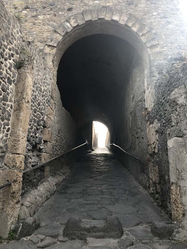 Pompeii Porta Marina. April 2019. Looking east through tunnel under arch, into city. 
Photo courtesy of Rick Bauer.
