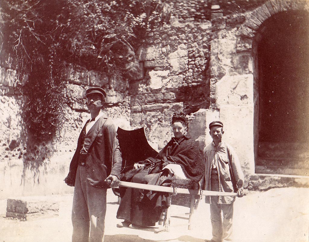 Pompeii Porta Marina. c.1910 photo of a tourist in a sedan chair. Photo courtesy of Drew Baker.