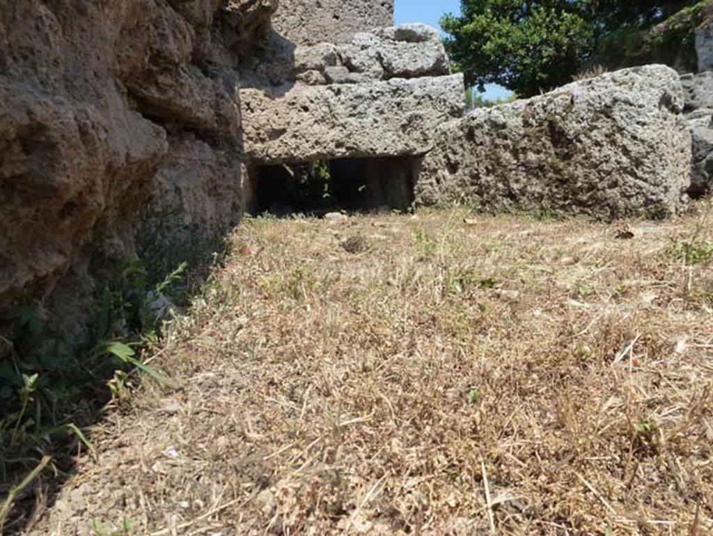 Porta di Sarno or Sarnus Gate. June 2012. North side of gate, at west end. Photo courtesy of Michael Binns.
According to Van der Graaff –
“The Porto Sarno also preserves an inlet that drained water from the Via dell’Abbondanza incorporated in the gate court wall, pointing to a date coinciding with the construction of the vaults or earlier.”
See Van der Graaff, I. (2018). The Fortifications of Pompeii and Ancient Italy. Routledge, (p.104). 

