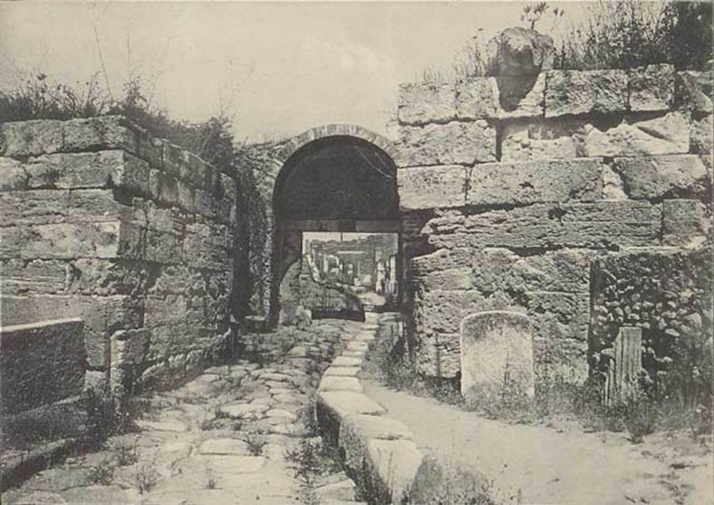 Porta di Stabia. Early 20th century.
Looking north to Cippus of L. Avianius Flaccus and Q. Spedius Firmus, with lion spout perched on wall above. Photo courtesy of Drew Baker.