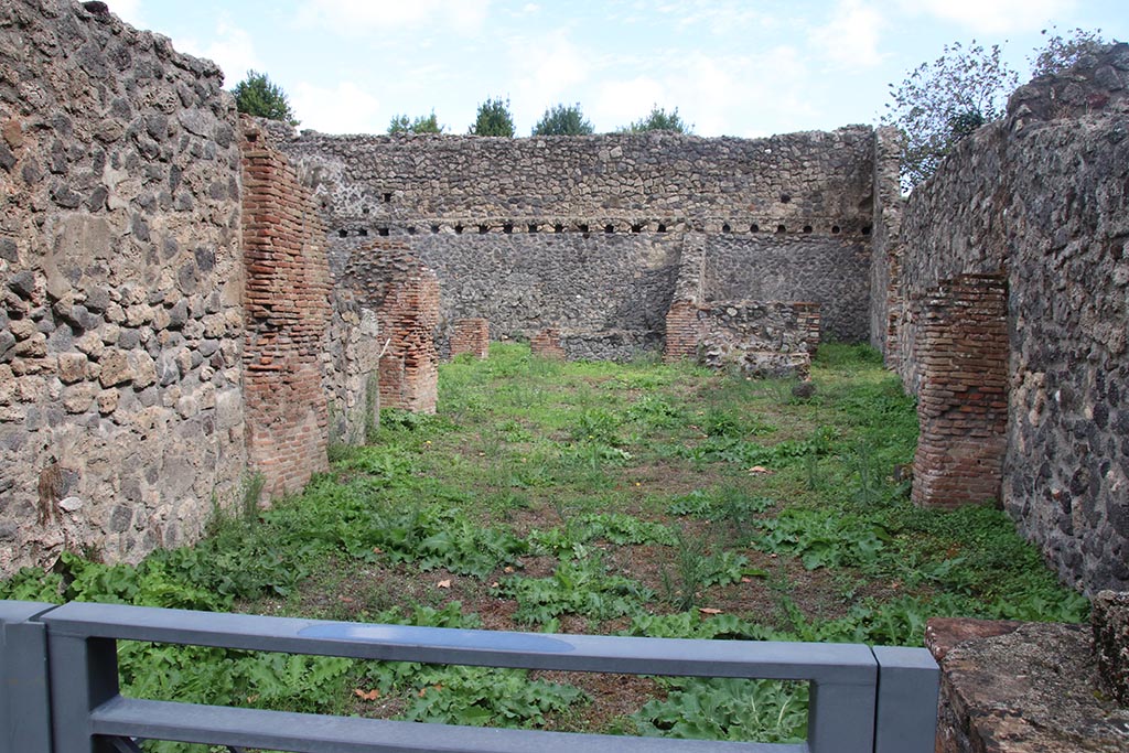 I.1.3 Pompeii, October 2024. Looking east from entrance doorway towards yard and stables at rear. Photo courtesy of Klaus Heese.