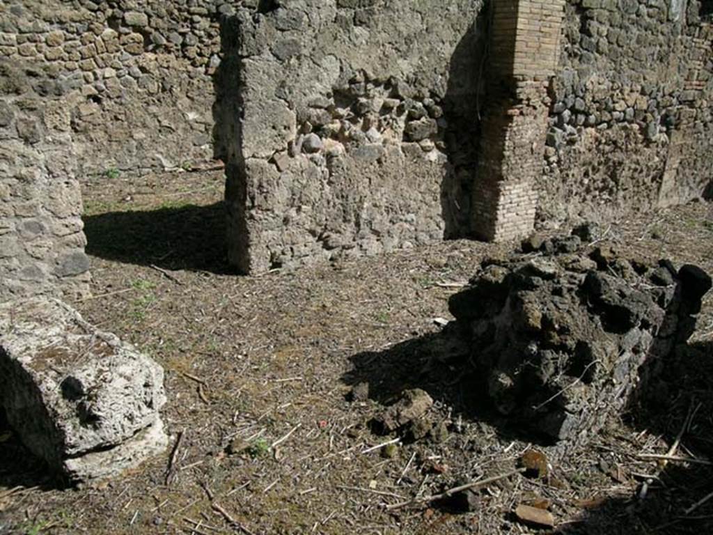 I.1.4 Pompeii. June 2006.Looking across counter/podium towards north wall of shop-room. Photo courtesy of Nicolas Monteix.