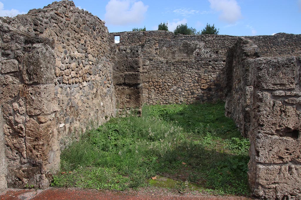 I.1.5 Pompeii. October 2024. Looking east across shop-room towards rear room. Photo courtesy of Klaus Heese.