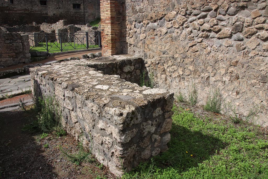 I.1.9 Pompeii. October 2024. Looking north-west across bar-room towards rear of counter. Photo courtesy of Klaus Heese.