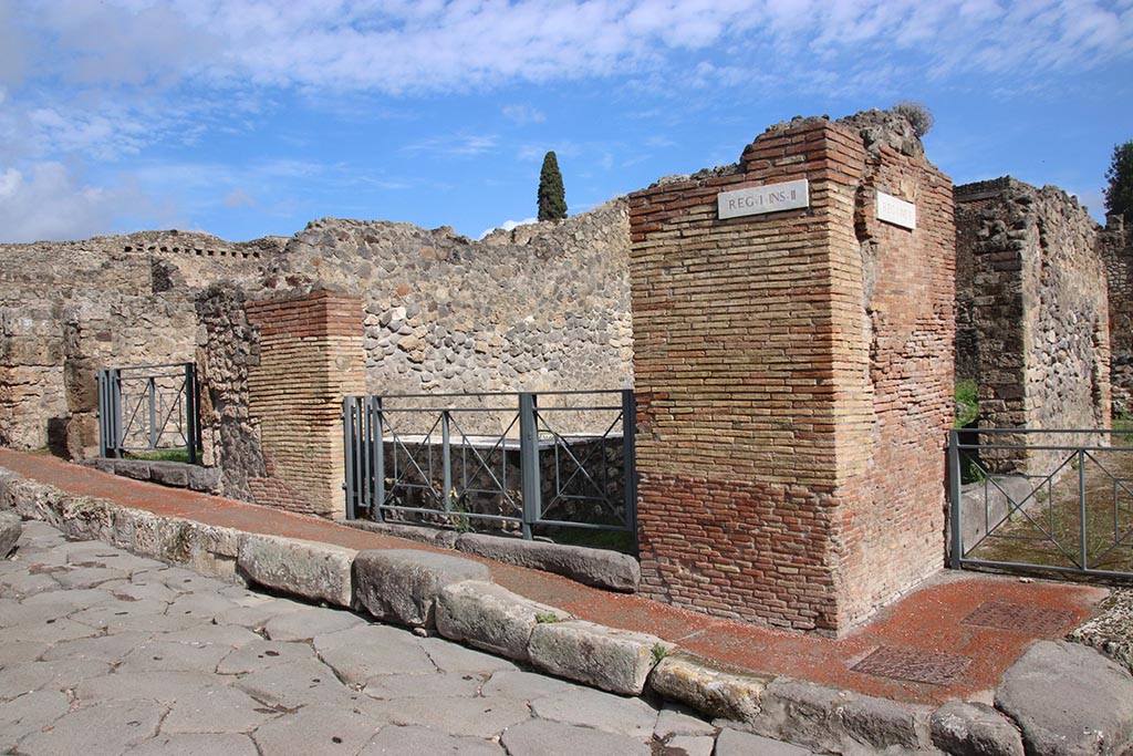 I.2.1 Pompeii. October 2024. 
Looking north-east from Via Stabiana, with Vicolo del Conciapelle, and entrance I.2.32, on right. Photo courtesy of Klaus Heese.

