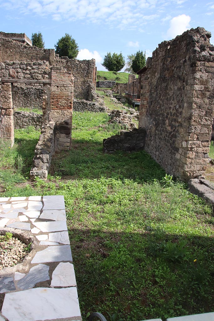 I.2.1 Pompeii. October 2024. Looking east into rear room on south side. Photo courtesy of Klaus Heese.
