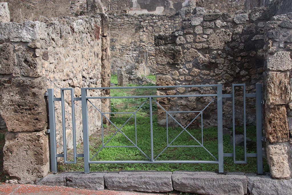 I.2.2 Pompeii. October 2024. Looking east towards entrance doorway into shop-room. Photo courtesy of Klaus Heese.