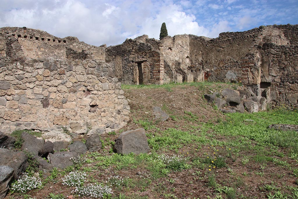 I.2.3 Pompeii. October 2024. Looking towards remains of north wall of atrium, and into I.2.6. Photo courtesy of Klaus Heese.