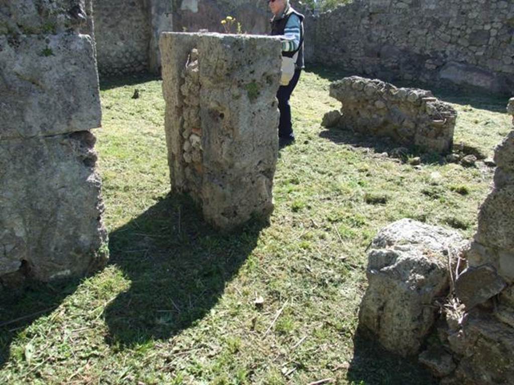 I.2.16 Pompeii. March 2009.  Looking south-west from room 3, with small doorway to room 4 (on left), and doorway to east portico (on right).
