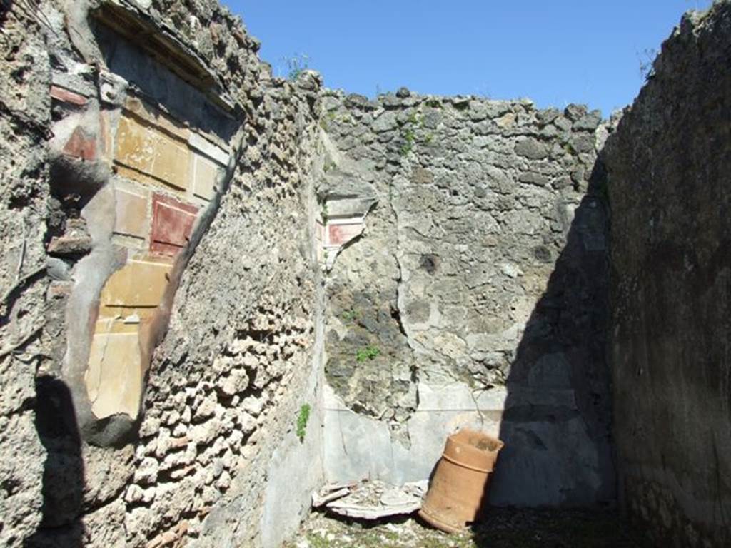 I.2.16 Pompeii. March 2009. Room 5, north wall, north-east corner and east wall of cubiculum, with remaining painted plaster.
