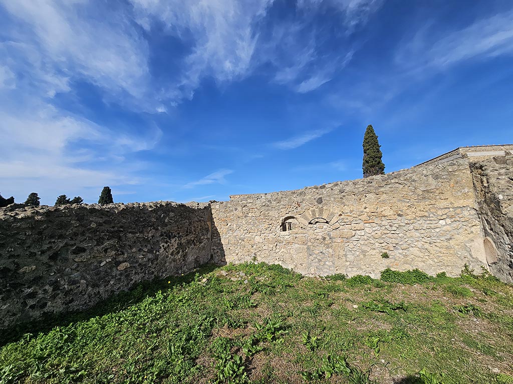 I.2.20 Pompeii. November 2024. Looking towards north wall of garden area, with niche. Photo courtesy of Annette Haug.