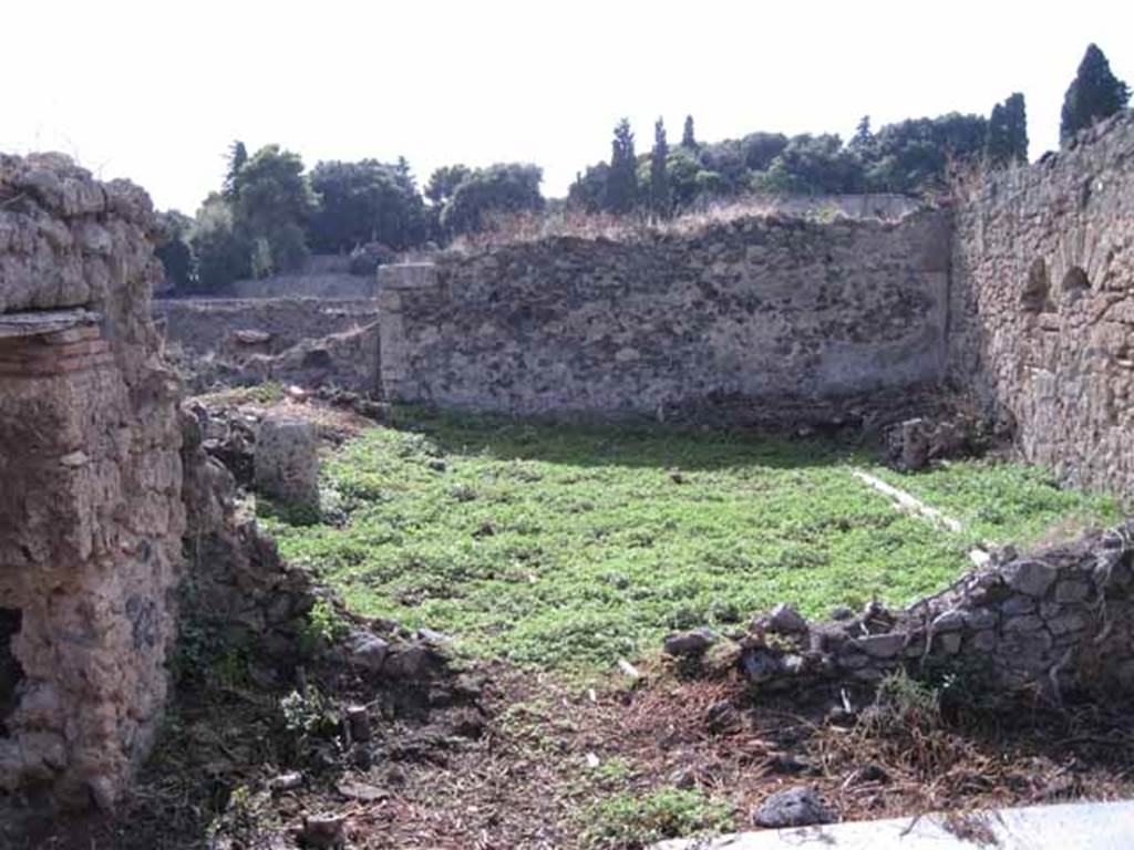 I.2.20 Pompeii. September 2010. 
Looking west from small atrium towards garden area, with doorway to kitchen, on the left. Photo courtesy of Drew Baker.




