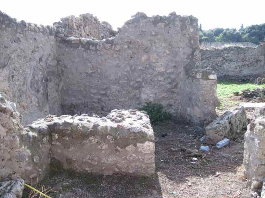 I.2.21 Pompeii. September 2010. Looking west towards entrance doorway across vicolo.
Photo courtesy of Drew Baker. According to Warscher, quoting Fiorelli, she described 
Il thermopolium no.21 aveva una sola taberna, col banco rivestito di marmi, ed un separato focolare, a destra della porta.  (translation: The thermopolium no.21, had only one room, with bench faced with marble, and a separate hearth, to the right of the door.)
See Fiorelli, Descrizione, p.45/46.
See Pappalardo, U., 2001. La Descrizione di Pompei per Giuseppe Fiorelli (1875). Napoli: Massa Editore, (p.36).
See Warscher T., 1935. Codex Topographicus Pompeianus: Regio I.2. Rome: DAIR, whose copyright it remains.


