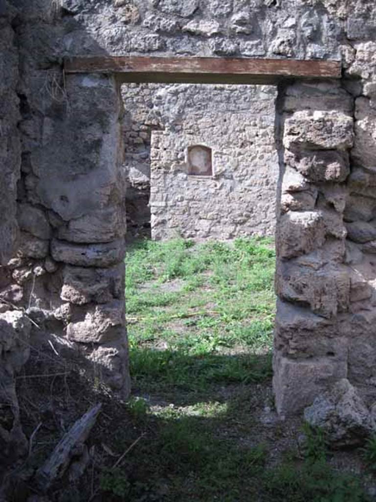 I.2.22 Pompeii. September 2010. Doorway leading north into shop. Photo courtesy of Drew Baker.
