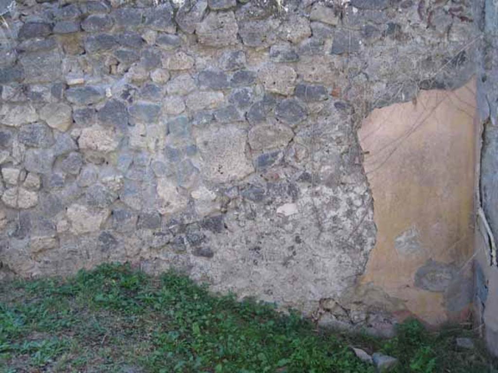 I.2.28 Pompeii. September 2010. West wall and north-west corner of room on east side of corridor. Photo courtesy of Drew Baker.
