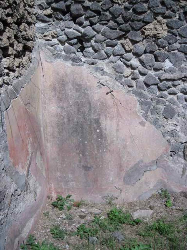 I.2.28 Pompeii. September 2010. North-east corner with remaining painted plaster. Photo courtesy of Drew Baker.
