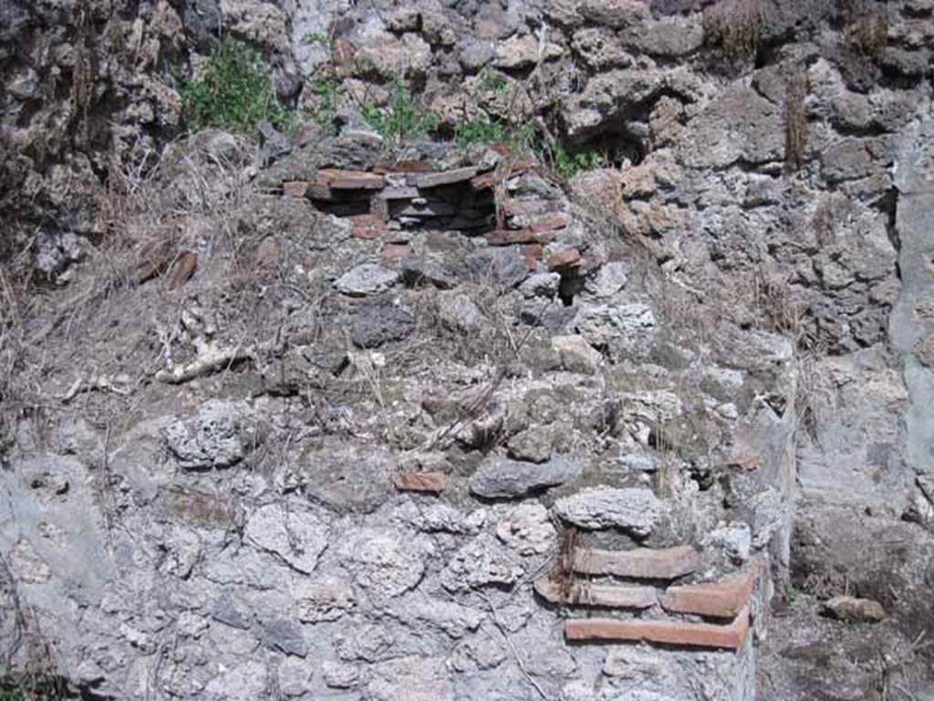 I.2.28 Pompeii. September 2010. Looking east from small room across side of oven in kitchen area. Photo courtesy of Drew Baker.
