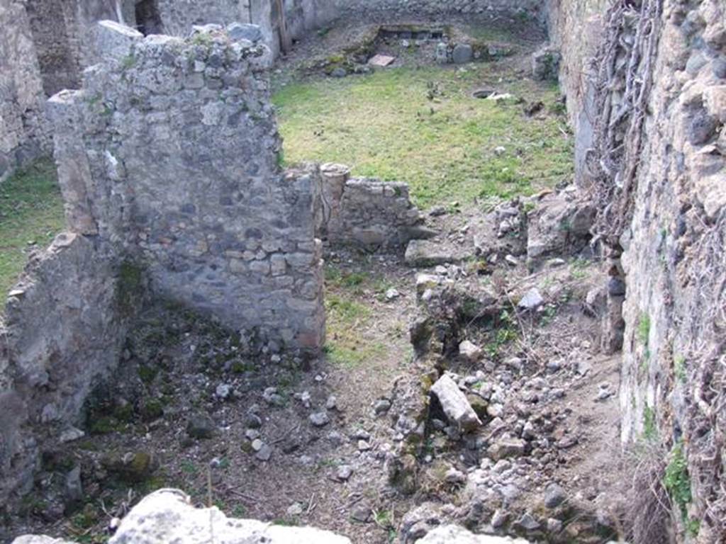 I.2.28 Pompeii.  March 2009.  Looking west above Kitchen area.  Taken from I.2.20.   According to Fiorelli, this comprised an ample hearth, two rooms as cells, the latrine, a staircase to the floor above, and at the back of the portico a cupboard between two small masonry walls.  See Pappalardo, U., 2001. La Descrizione di Pompei per Giuseppe Fiorelli (1875). Napoli: Massa Editore. p.38
