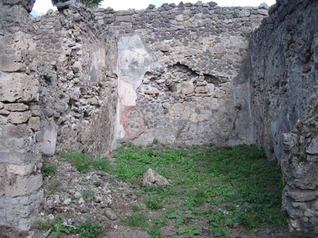 I.2.28 Pompeii. September 2010. Looking east into large triclinium on east side of portico. Photo courtesy of Drew Baker. According to Fiorelli, this room was adorned with paintings, of which two were saved. One of a big country scene with pastoral sacrarium and goats. The other showing Cassandra and Hector predicting the ruin of Troy to Priam, caused by the young boy Paris. Paris is leaning against the Kings knee holding an apple. See Pappalardo, U., 2001. La Descrizione di Pompei per Giuseppe Fiorelli (1875). Napoli: Massa Editore. (p.37 and black and white drawing)
According to Sogliano, paintings found in the triclinium were 
Amore and Psiche at the hunt, on a black background, and Eros at the hunt, on a black background (p. 64, nos. 374 and 375).
Prophecy of Cassandra. Now in Naples Archaeological Museum: 111476.This was found damaged at the upper corner (p.105, no.560).  
Landscape: the scene represented a valley between high mountains (p.141, no.684)
See Sogliano, A., 1879. Le pitture murali campane scoverte negli anni 1867-79. Napoli: (pages, as above)

