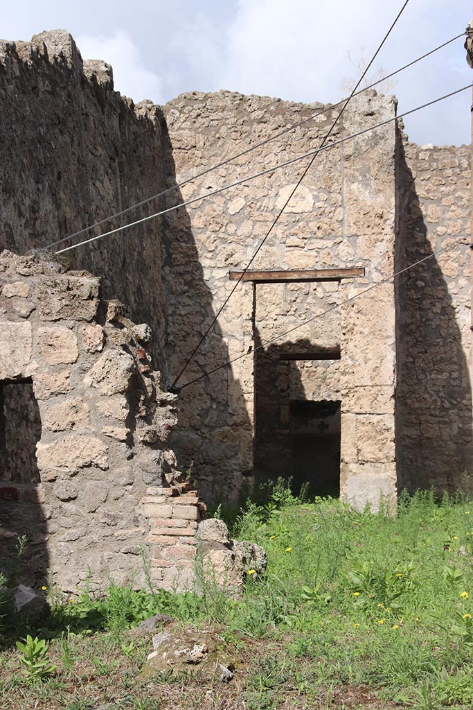 I.2.29 Pompeii. October 2024. 
Site of doorway in north wall, at its rear was the atrium of I.2.28. Photo courtesy of Klaus Heese.
