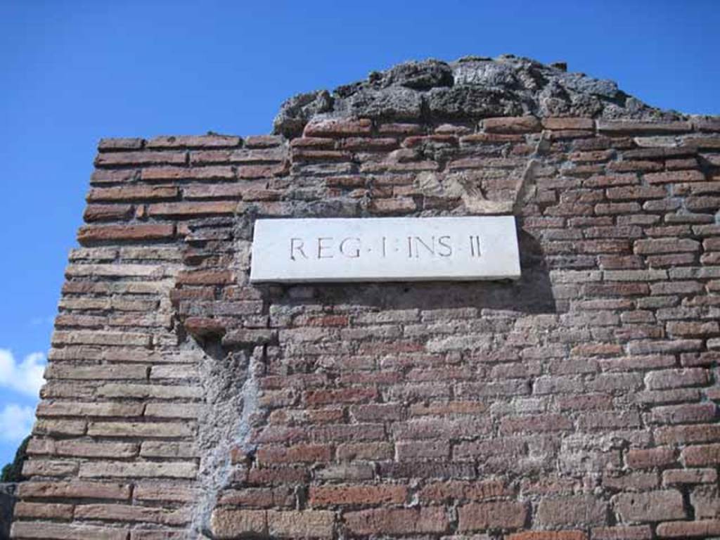 I.2.32 Pompeii. September 2010.  ID insula number plate, on wall on corner of Vicolo del Conciapelle and Via Stabiana.  Photo courtesy of Drew Baker.
