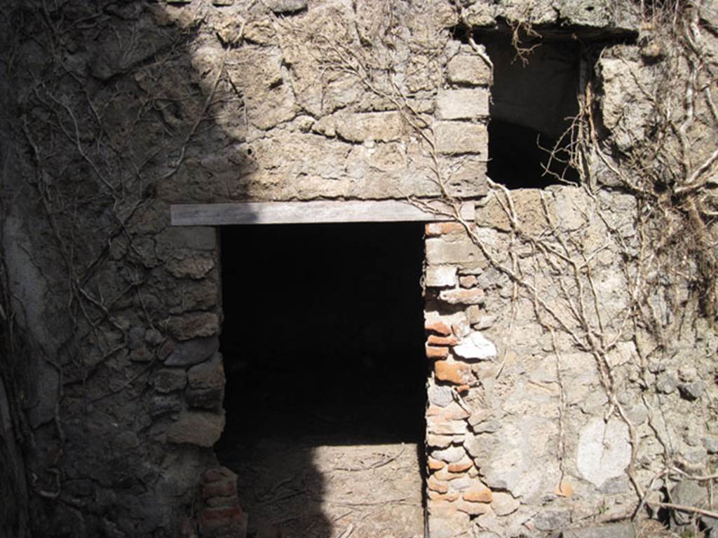 I.3.3 Pompeii. September 2010. Subterranean Level, looking towards north wall of room or yard, with doorway and window into room on north side. Photo courtesy of Drew Baker.