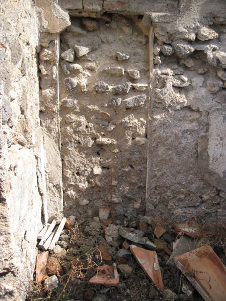 I.3.3 Pompeii. September 2010. East wall of cubiculum, with blocked doorway in north-east corner. Photo courtesy of Drew Baker.
