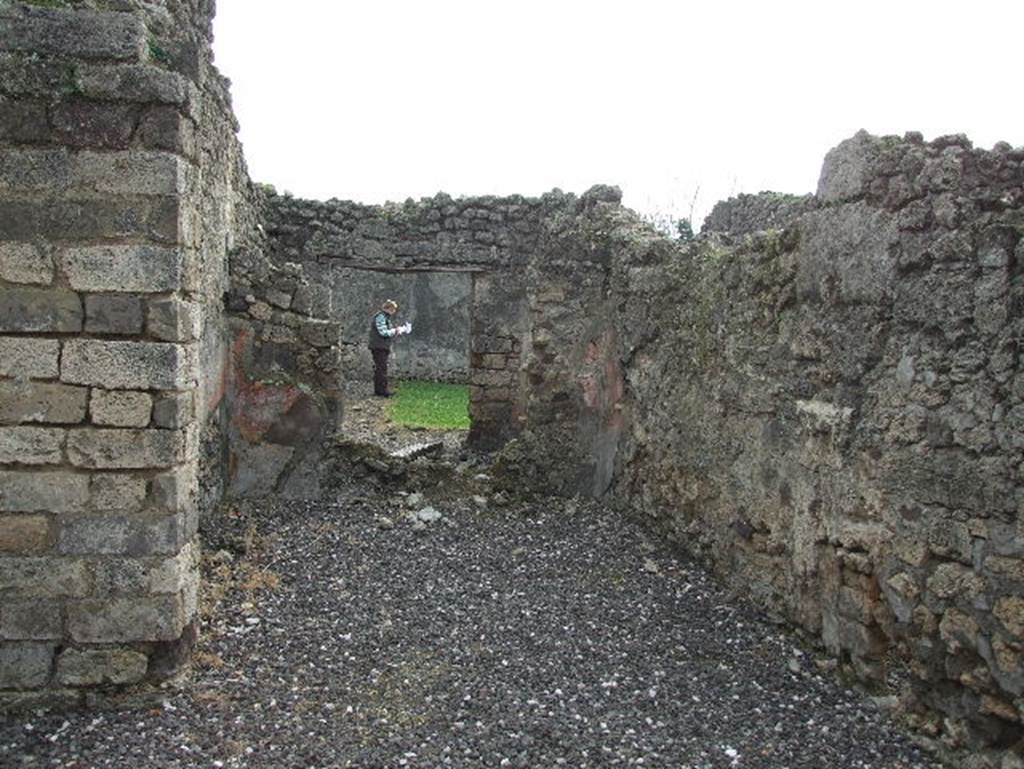 I.3.24 Pompeii. December 2006. Two rooms on south of atrium. Looking south across tablinum, and adjoining room overlooking peristyle/garden area, (at the rear).



