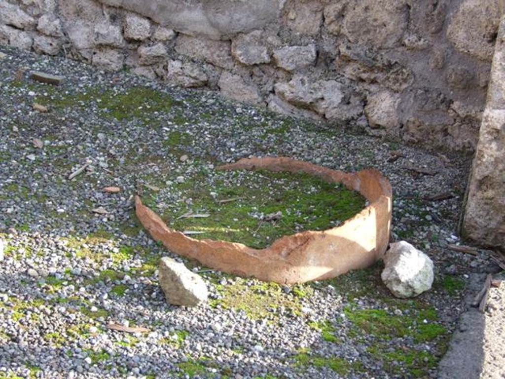 I.4.11 Pompeii. December 2007. Urn buried in south-west corner of shop.