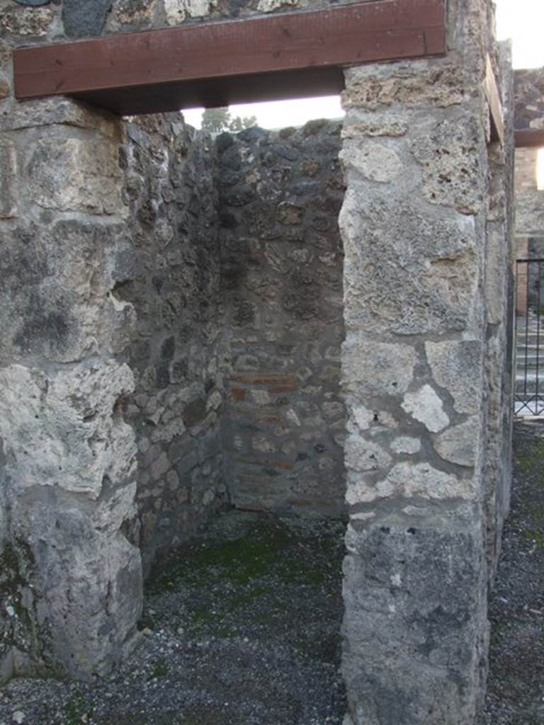 I.4.25 Pompeii. December 2007. 
Doorway to room 5, looking west into small room or ostiarius with two doorways.
Photograph is taken from the atrium, and the other door is in the south wall of the fauces/entrance corridor. 
