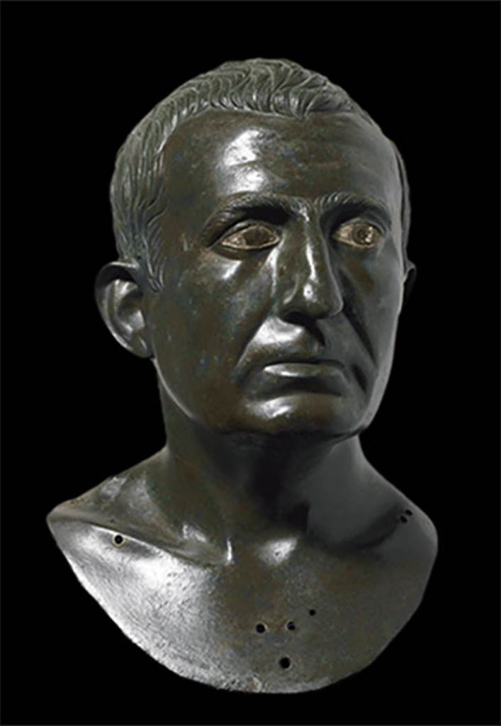 I.4.25 Pompeii. Atrium 6, floor of I.4.5 next to the tablinum, room 14. 
Portrait bronze bust of a man presumed to be one of the owners.
It is one of a pair, placed on herms in the atrium on either side of the entrance to the tablinum. 
Now in Naples Archaeological Museum. Inventory number 4989. 
