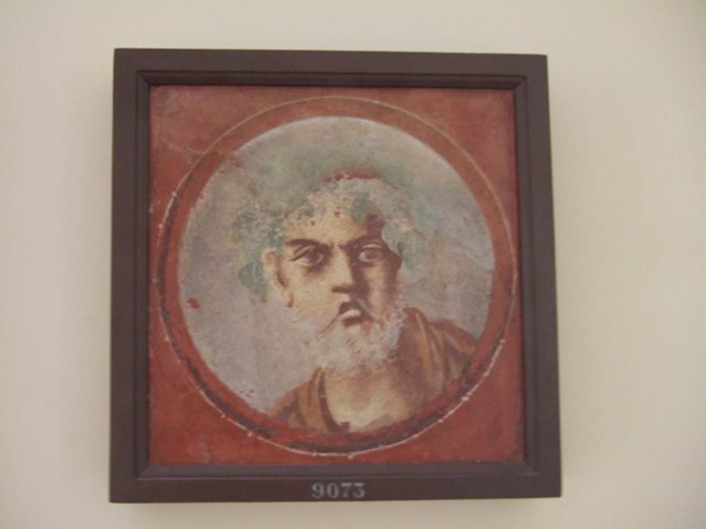 I.4.25 Pompeii. December 2007. Room 18, west wall. Painted medallion of an old man with grey beard. 
Now in Naples Archaeological Museum. Inventory number 9073.
