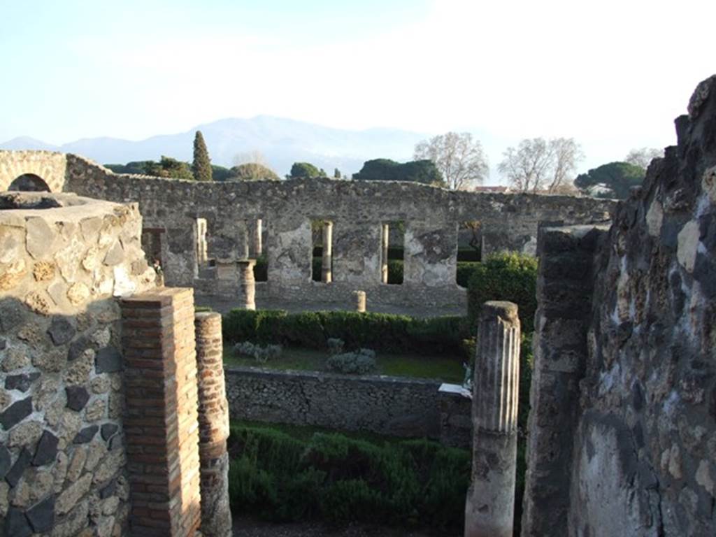 I.4.25 Pompeii. December 2007. Looking south from upper peristyle 56 across the middle peristyle 17.