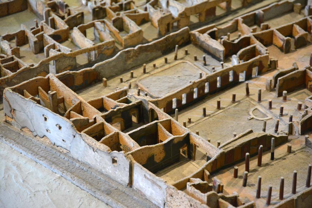I.4.5 Pompeii. May 2019. Detail from model in Naples Archaeological Museum.
Looking south-west towards Middle Peristyle 17, lower centre right, with rooms at east end numbered 19,20,21,22,23 and 24, lower centre left.

