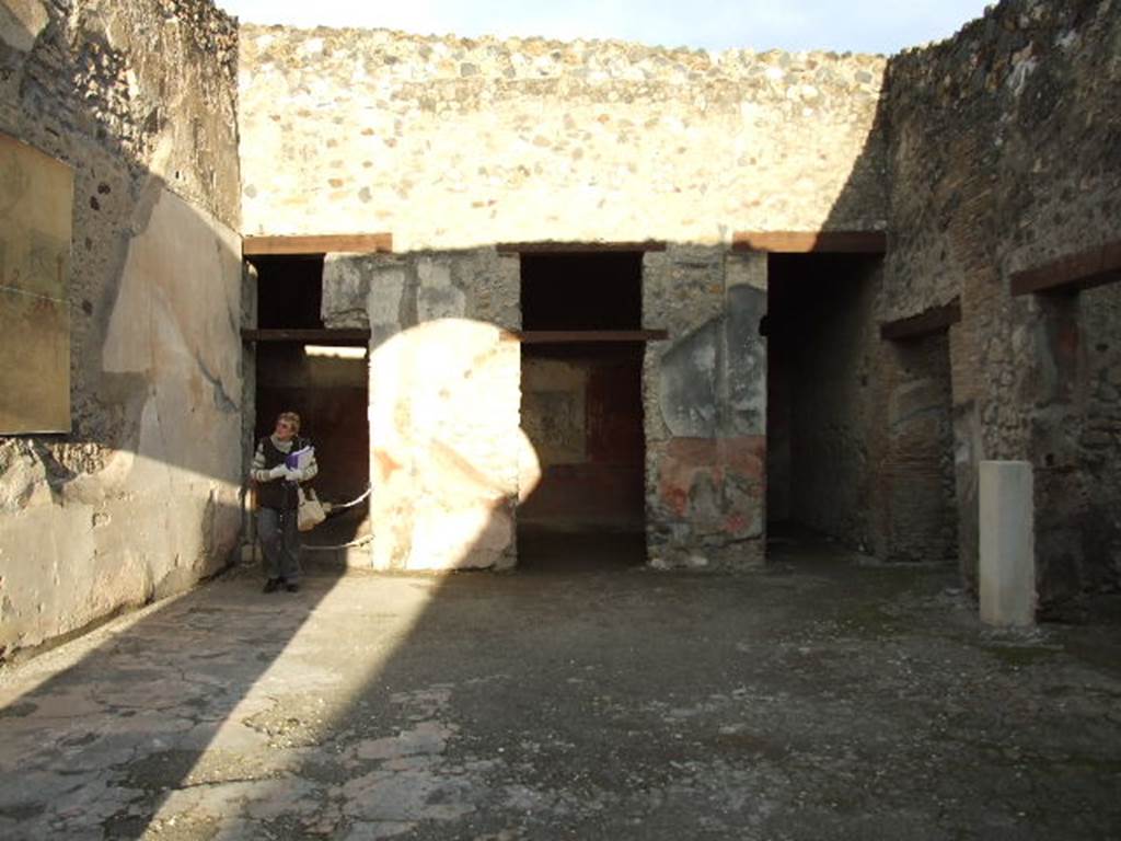 I.4.25 Pompeii. December 2006. Room 21, view across oecus of the Judgement of Paris.
There are doors to two cubiculum and a storeroom or apotheca at rear. Doors to a corridor and to a triclinium are to the right.
