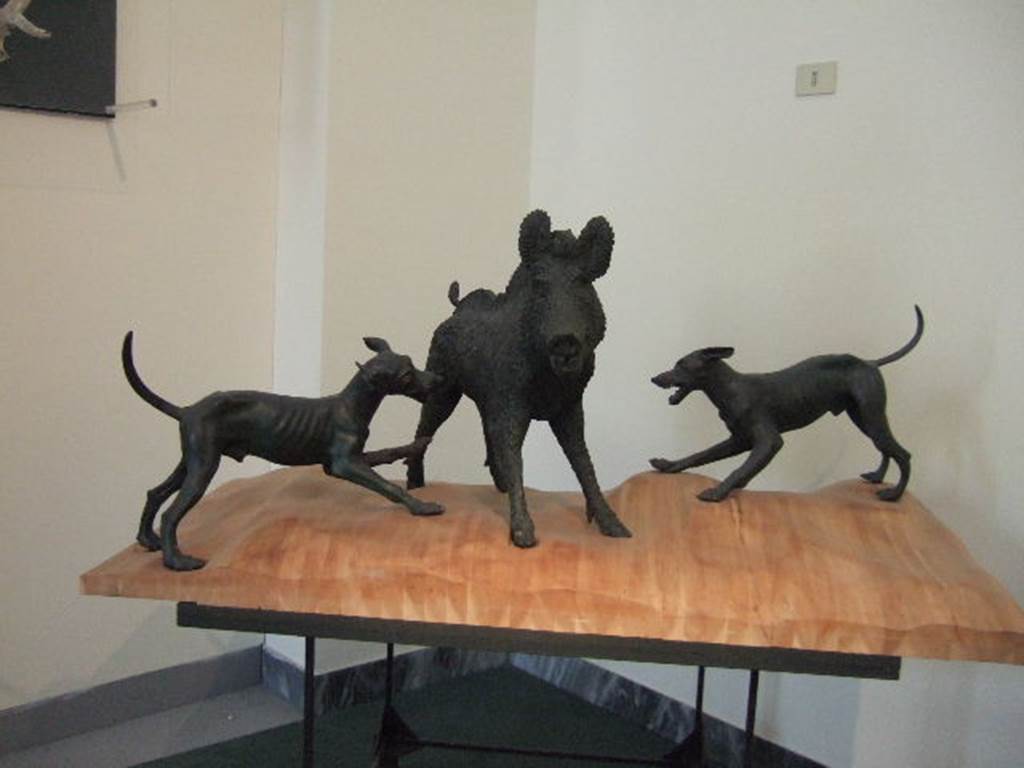 Middle Peristyle 17, Bronze group of a boar being attacked by dogs. This was found in I.4.5/25. Now in Naples Archaeological Museum.