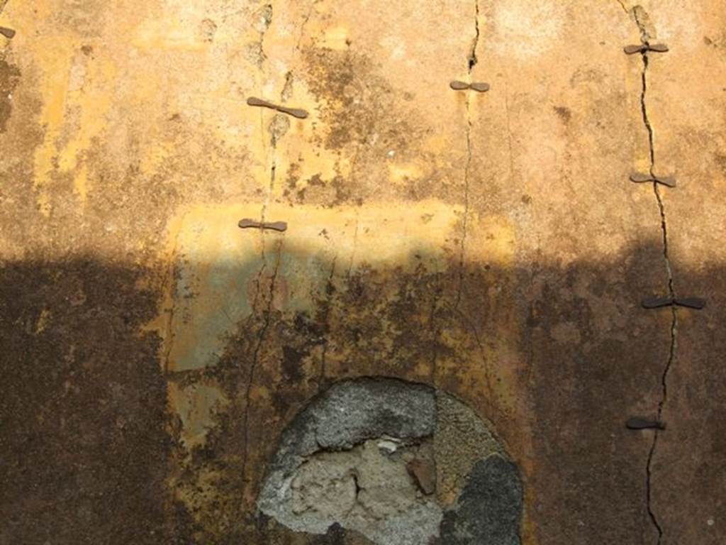 I.4.25 Pompeii. December 2007. Room 58, oecus on east side of upper peristyle. East wall, with remains of faded wall painting.
