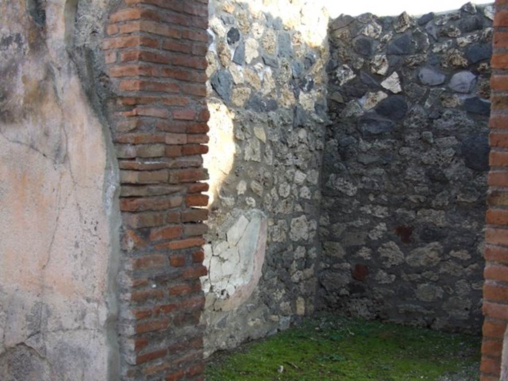 I.4.25 Pompeii. December 2007. Room 58, oecus on east side of upper peristyle. South wall with doorway into room 59.
