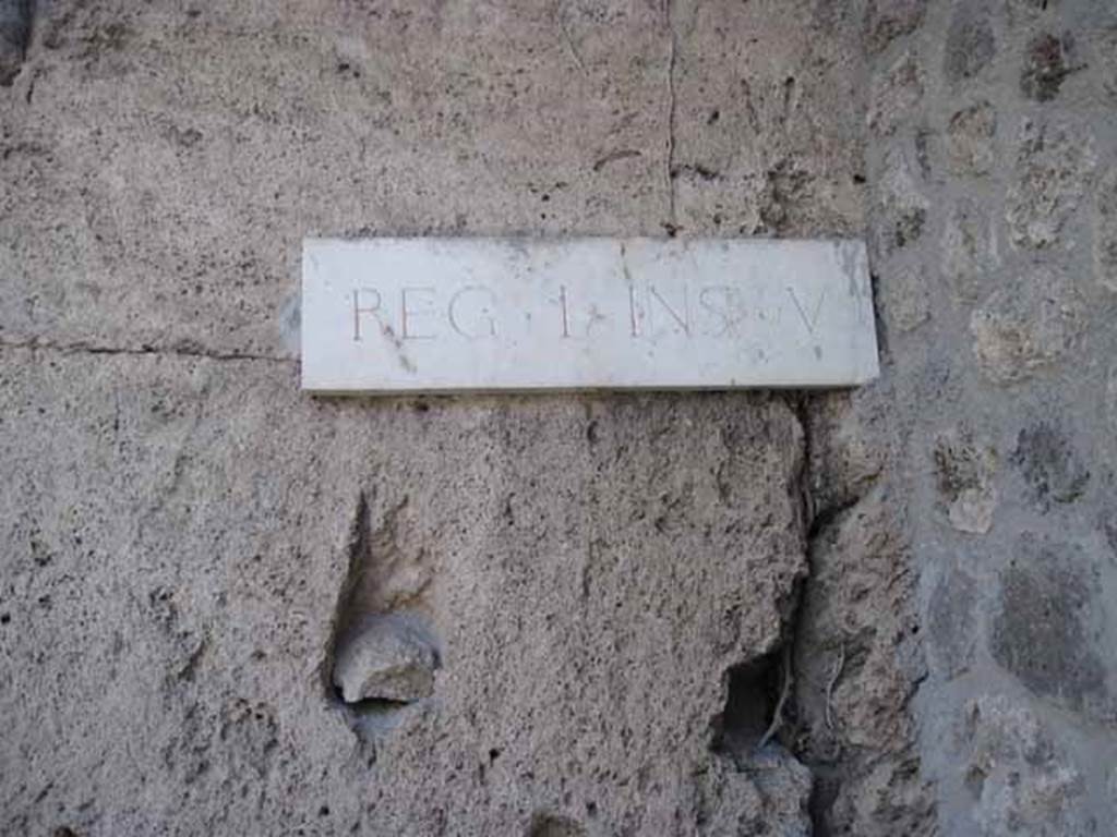 I.5.1 Pompeii. September 2010. ID plate on west side of entrance doorway.
Photo courtesy of Drew Baker.

