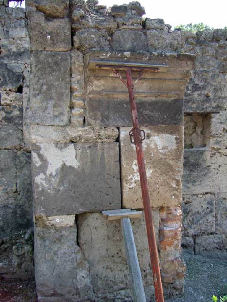 I.5.1 Pompeii. September 2005. Detail of portico or structure on east side, in roadway between I.5.1 and I.5.2. Looking south. 