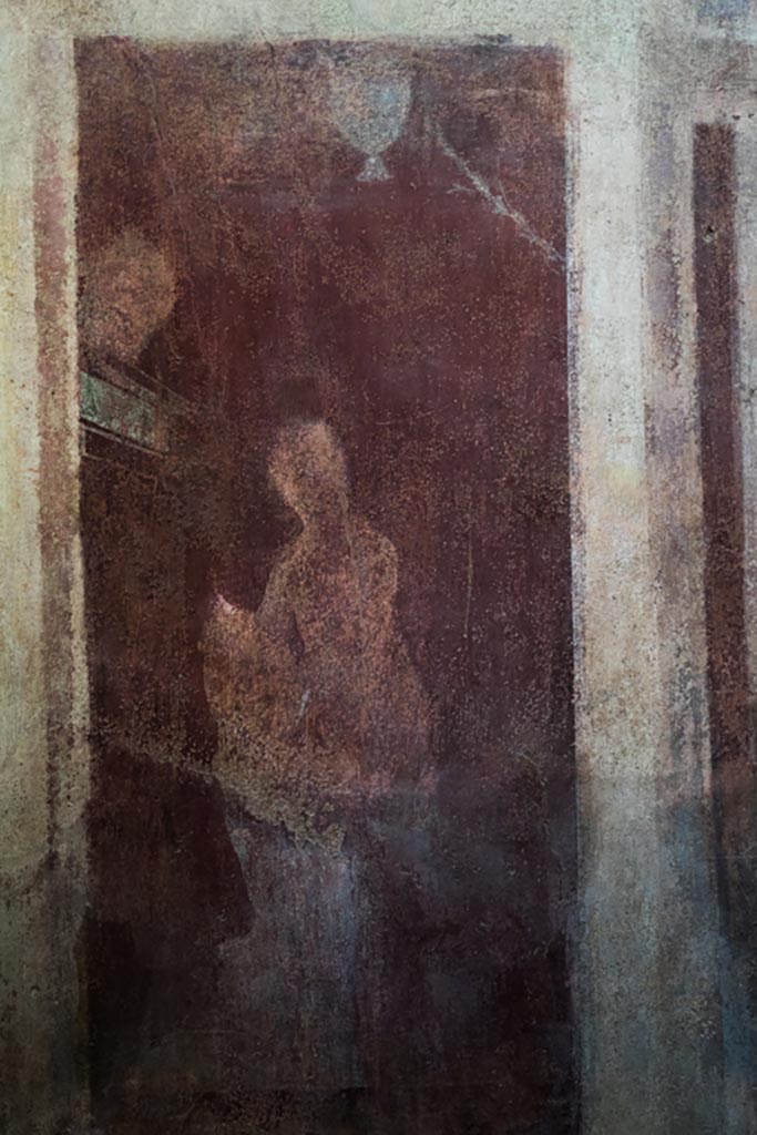 I.6.2 Pompeii. October 2023. 
North wall of frigidarium at west end, detail of panel below painting of two women on a balcony.
Photo courtesy of Johannes Eber.
