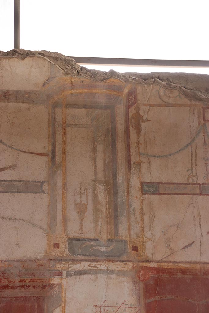 I.6.4 Pompeii. October 2024. 
Room 5, detail from upper east wall towards south end. Photo courtesy of Klaus Heese.
